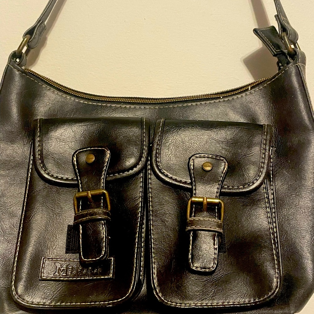 Muda. Black bag, used with signs of use, with 2 bags in front, very practical.